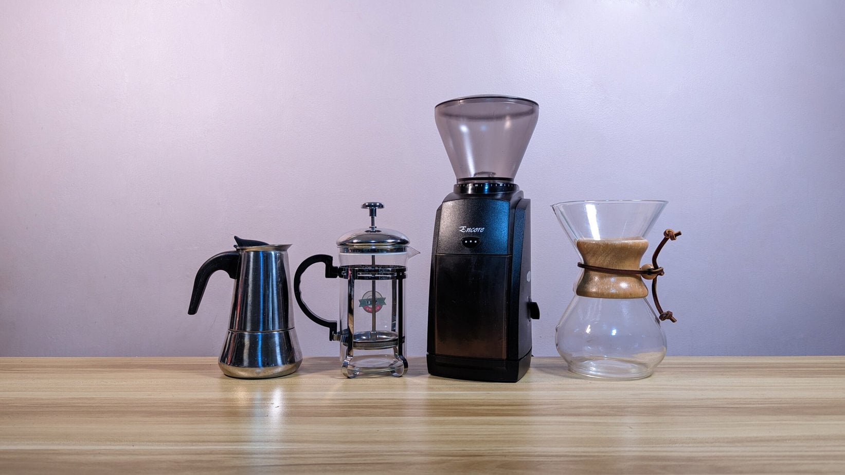 Baratza Encore next to moka pot, pour over and french press on the kitchen table