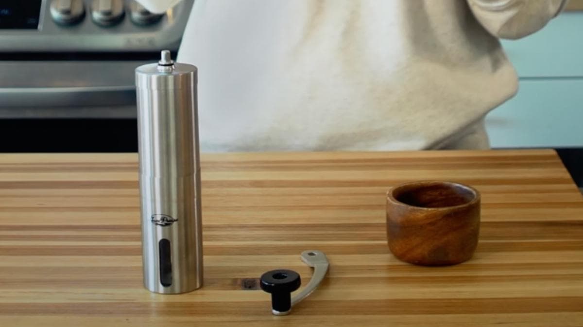 Javapresse Manual Burr Grinder on the wooden table 