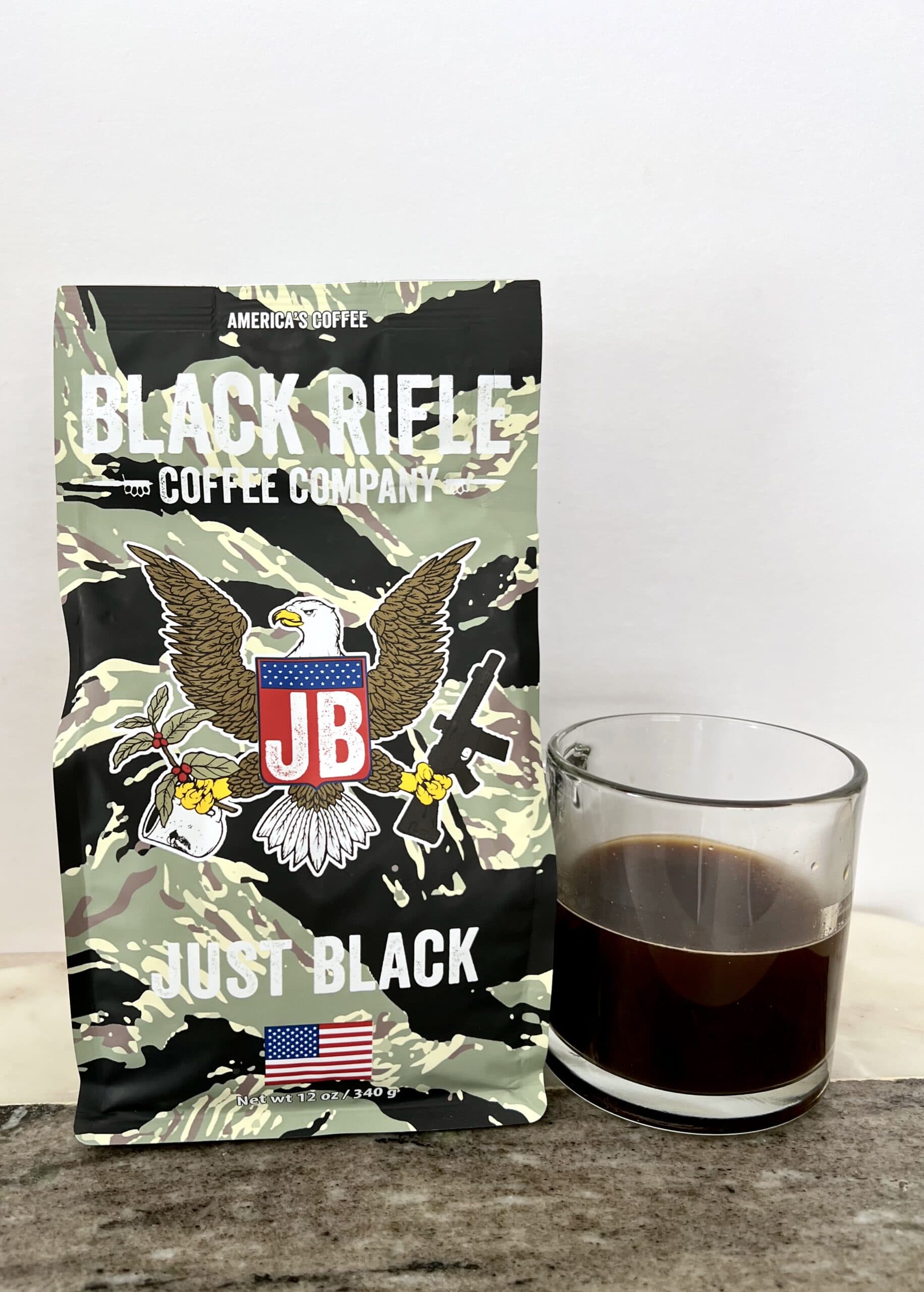 Just Black - Black Rifle Coffee next to the brewed coffee mugs