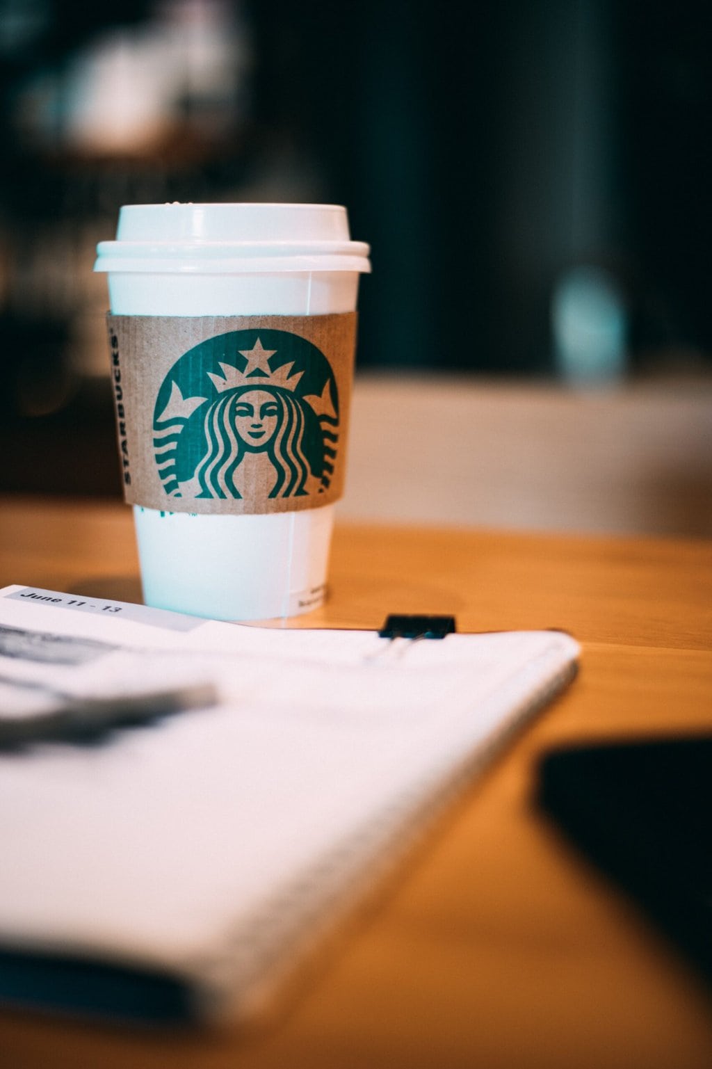 Starbucks coffee cup on the wood table 