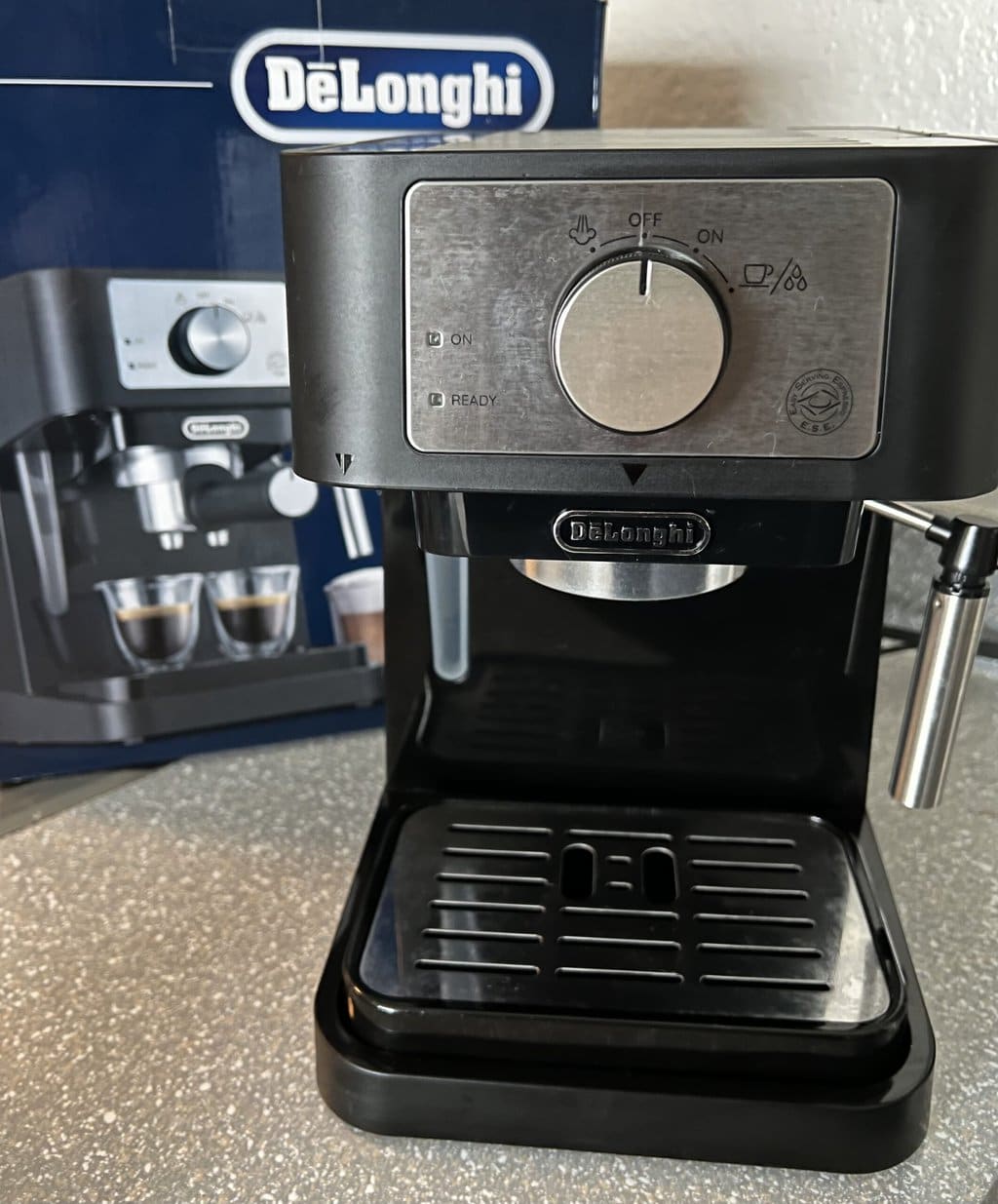 the DeLonghi Stilosa EC260 espresso machine on the background of the box